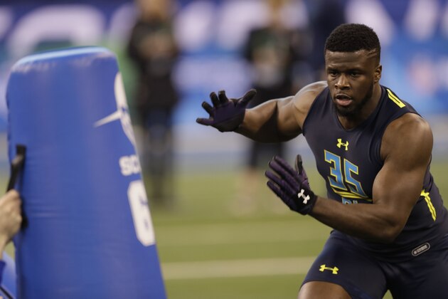 Northwestern defensive end Ifeadi Odenigbo runs a drill at the NFL football scouting combine Sunday, March 5, 2017, in Indianapolis. (AP Photo/David J. Phillip)