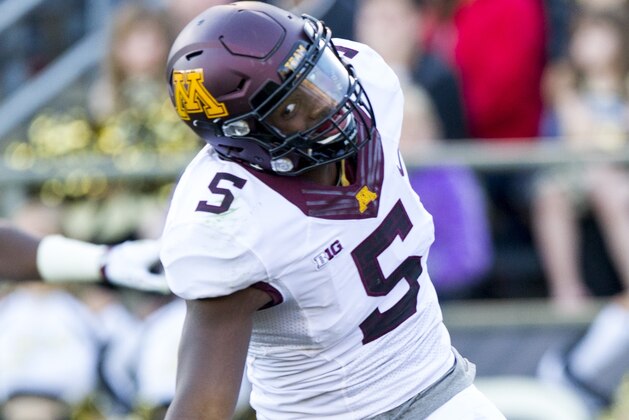 Minnesota defensive back Jalen Myrick (5) celebrates after running the ball in to the end zone to score off a pick six against Purdue during the second half of an NCAA college football game, Saturday, Oct. 10, 2015, in West Lafayette, Ind. Minnesota won 41-13. (AP Photo/Doug McSchooler)