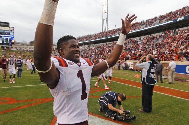 Virginia Tech wide receiver Isaiah Ford (1) waves to the crowd after his team defeated Virginia 23-20 after an NCAA college football game in Charlottesville, Va., Saturday, Nov. 28, 2015.  (AP Photo/Steve Helber)