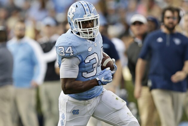 North Carolina's Elijah Hood (34) runs against The Citadel during the first half of an NCAA college football game in Chapel Hill, N.C., Saturday, Nov. 19, 2016. (AP Photo/Gerry Broome)