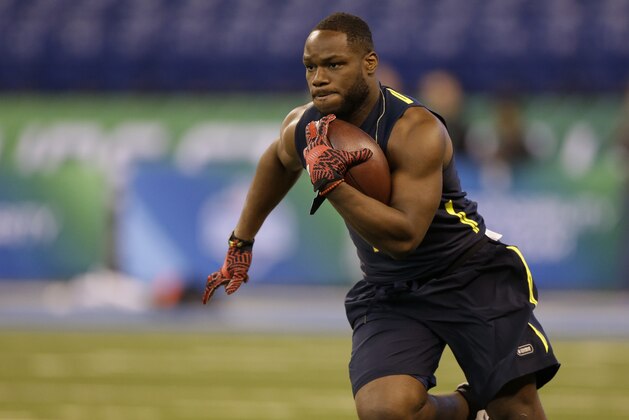 North Carolina State running back Matthew Dayes runs a drill at the NFL football scouting combine in Indianapolis, Friday, March 3, 2017. (AP Photo/Michael Conroy)
