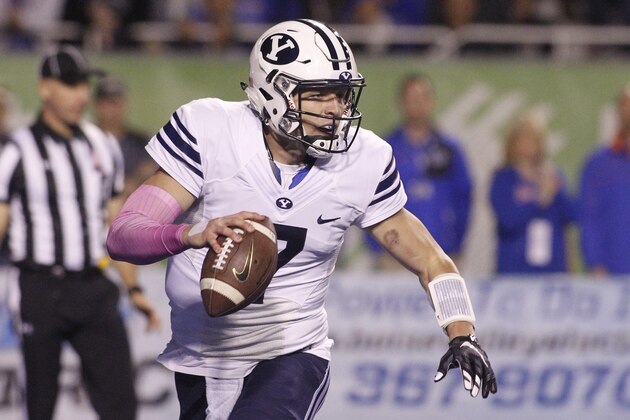 BYU quarterback Taysom Hill (7) looks for a receiver during the first half of an NCAA college football game against Boise State in Boise, Idaho, Thursday, Oct. 20, 2016. Boise State won 28-27. (AP Photo/Otto Kitsinger)