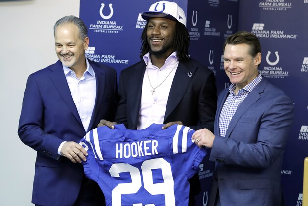 Indianapolis Colts first round draft pick Malik Hooker, center, holds a jersey with head coach Chuck Pagano, left, and general manager Chris Ballard during an NFL football news conference Friday, April 28, 2017, in Indianapolis. (AP Photo/Darron Cummings)