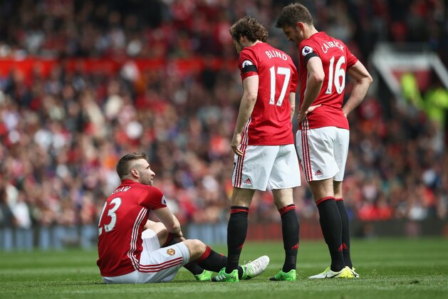 MANCHESTER, ENGLAND - APRIL 30:  Daley Blind of Manchester United and Michael Carrick of Manchester United check is Luke Shaw of Manchester United is okay after he goes down holding his leg during the Premier League match between Manchester United and Swansea City at Old Trafford on April 30, 2017 in Manchester, England.  (Photo by Jan Kruger/Getty Images)
