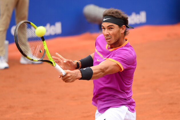 Spanish tennis player Rafael Nadal returns the ball to Austrian tennis player Dominic Thiem during the ATP Barcelona Open 'Conde de Godo' tennis tournament final in Barcelona on April 30, 2017. / AFP PHOTO / Josep LAGO        (Photo credit should read JOSEP LAGO/AFP/Getty Images)