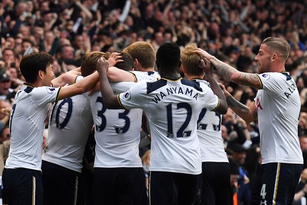 Tottenham Hotspur's English midfielder Dele Alli celebrates scoring the opening goal with teammates during the English Premier League football match between Tottenham Hotspur and Arsenal at White Hart Lane in London, on April 30, 2017.  / AFP PHOTO / Ben STANSALL / RESTRICTED TO EDITORIAL USE. No use with unauthorized audio, video, data, fixture lists, club/league logos or 'live' services. Online in-match use limited to 75 images, no video emulation. No use in betting, games or single club/league/player publications.  /         (Photo credit should read BEN STANSALL/AFP/Getty Images)