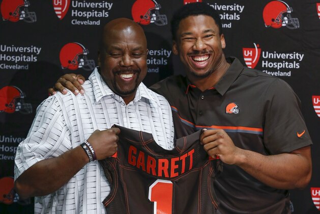 Cleveland Browns' Myles Garrett, right, poses with his father, Lawrence Garrett, during a news conference at the NFL team's training facility, Friday, April 28, 2017, in Berea, Ohio. (AP Photo/Ron Schwane)