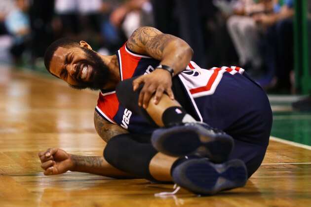 BOSTON, MA - APRIL 30: Markieff Morris #5 of the Washington Wizards grabs for his knee after  colliding with Al Horford #42 of the Boston Celtics during the second quarter of Game One of the Eastern Conference Semifinals at TD Garden on April 30, 2017 in Boston, Massachusetts. NOTE TO USER: User expressly acknowledges and agrees that, by downloading and or using this Photograph, user is consenting to the terms and conditions of the Getty Images License Agreement. (Photo by Maddie Meyer/Getty Images)
