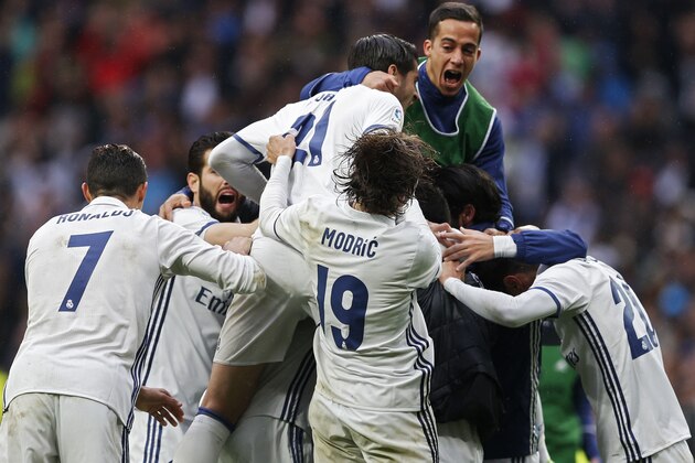 Real Madrid players celebrate their side's second goal against Valencia during the Spanish La Liga soccer match between Real Madrid and Valencia at the Santiago Bernabeu stadium in Madrid, Saturday, April 29, 2017. Marcelo and Ronaldo each scored once in  Real Madrid's 2-1 victory. (AP Photo/Francisco Seco)