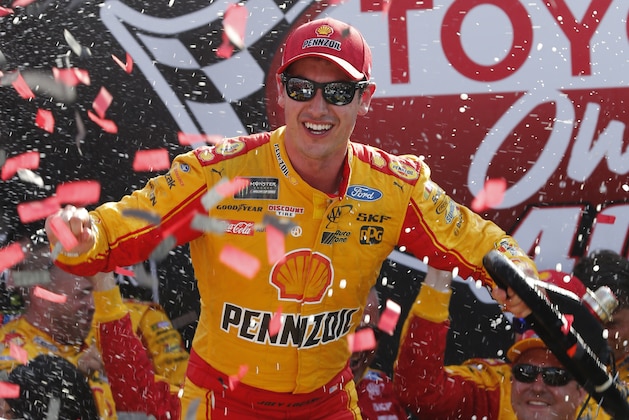 Joey Logano celebrates after winning the NASCAR Cup Series auto race in Victory Lane at Richmond International Raceway in Richmond, Va., Sunday, April 30, 2017. (AP Photo/Steve Helber)