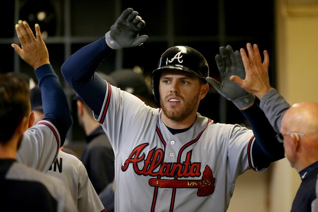MILWAUKEE, WI - APRIL 28:  Freddie Freeman #5 of the Atlanta Braves celebrates with teammates after hitting a home run in the ninth inning against the Milwaukee Brewers at Miller Park on April 28, 2017 in Milwaukee, Wisconsin. (Photo by Dylan Buell/Getty Images)