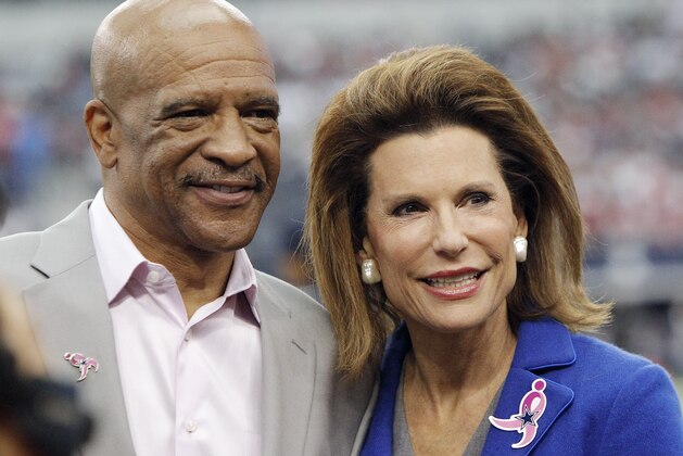 Former Dallas Cowboys Drew Pearson and Susan G. Komen Founder Nancy Brinker are seen before the start of the first half of an NFL football game against the Houston Texans, Sunday, Oct. 5, 2014, in Arlington, Texas. Dallas won 20-17 in overtime. (AP Photo/Brandon Wade)