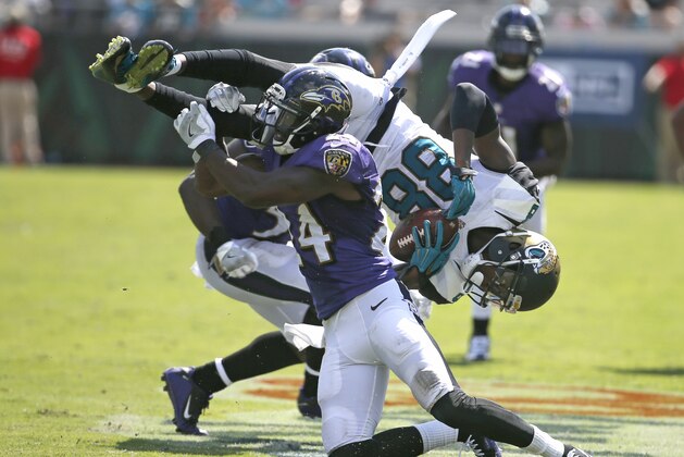 Baltimore Ravens' Shareece Wright upends Jacksonville Jaguars wide receiver Allen Hurns (88) during the second half of an NFL football game in Jacksonville, Fla., Sunday, Sept. 25, 2016. (AP Photo/Stephen B. Morton)