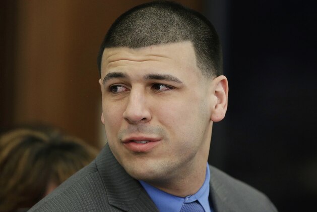 FILE - In this Friday, April 14, 2017, file photo, former New England Patriots tight end Aaron Hernandez turns to look toward his fiancee Shayanna Jenkins Hernandez as he reacts to his double murder acquittal at Suffolk Superior Court in Boston. Kyle Kennedy, a jailhouse friend of Aaron Hernandez said prison officials denied the former NFL star's request for a cellmate months before he hanged himself. Kennedy's attorney, Lawrence Army, is speaking Wednesday, April 26, 2017, about how the two inmates were connected. (AP Photo/Stephan Savoia, Pool, File)
