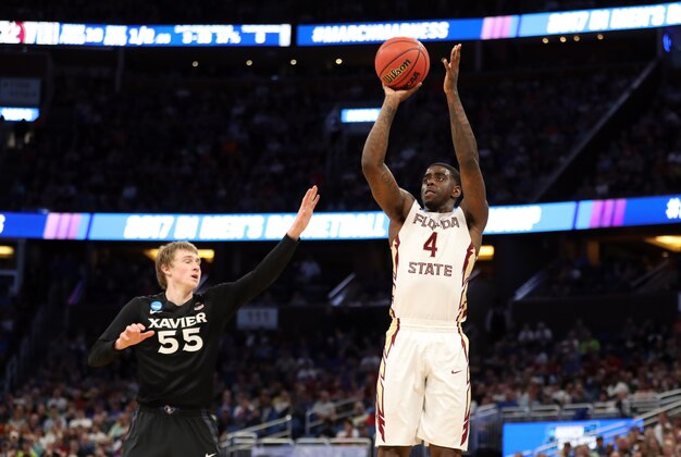 Mar 18, 2017; Orlando, FL, USA; Florida State Seminoles guard Dwayne Bacon (4) shoots against Xavier Musketeers guard J.P. Macura (55) during the second half in the second round of the 2017 NCAA Tournament at Amway Center. Mandatory Credit: Logan Bowles-USA TODAY Sports Mar 18, 2017; Orlando, FL, USA; Florida State Seminoles guard Dwayne Bacon (4) shoots against Xavier Musketeers guard J.P. Macura (55) during the second half in the second round of the 2017 NCAA Tournament at Amway Center. Mandatory Credit: Logan Bowles-USA TODAY Sports