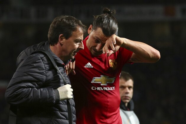 Manchester United's Zlatan Ibrahimovic leaves the field with an injury during the Europa League quarterfinal second leg soccer match between Manchester United and Anderlecht at Old Trafford stadium, in Manchester, England, Thursday, April 20, 2017. (AP Photo/Dave Thompson)