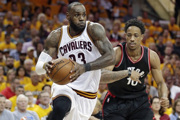 Cleveland Cavaliers' LeBron James (23) drives past Toronto Raptors' DeMar DeRozan (10) in the second half in Game 1 of a second-round NBA basketball playoff series, Monday, May 1, 2017, in Cleveland. The Cavaliers won 116-105. (AP Photo/Tony Dejak)