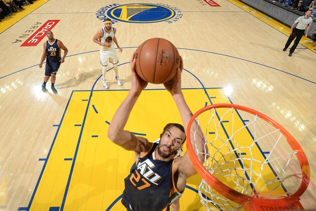 OAKLAND, CA - APRIL 10: Rudy Gobert #27 of the Utah Jazz dunks against the Golden State Warriors on April 10, 2017 at ORACLE Arena in Oakland, California. NOTE TO USER: User expressly acknowledges and agrees that, by downloading and or using this photograph, user is consenting to the terms and conditions of Getty Images License Agreement. Mandatory Copyright Notice: Copyright 2017 NBAE (Photo by Noah Graham/NBAE via Getty Images)