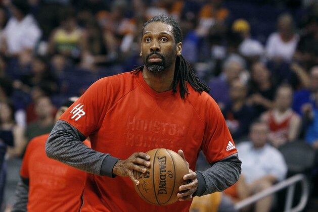 Houston Rockets center Nene warms up before the start of an NBA basketball game against the Phoenix Suns, Sunday, April 2, 2017, in Phoenix. The Rockets defeated the Suns 123-116. (AP Photo/Ralph Freso)