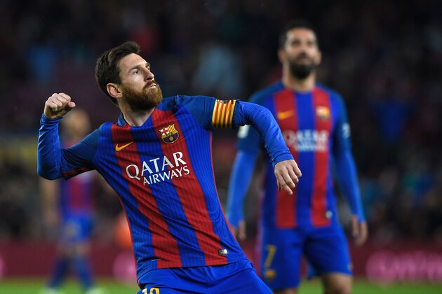 Barcelona's Argentinian forward Lionel Messi celebrates after scoring a goal during the Spanish league football match FC Barcelona vs CA Osasuna at the Camp Nou stadium in Barcelona on April 26, 2017. / AFP PHOTO / LLUIS GENE        (Photo credit should read LLUIS GENE/AFP/Getty Images)