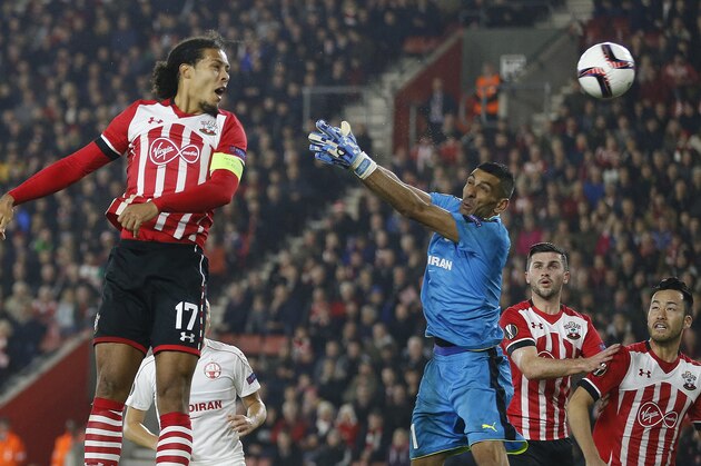 Southampton's Virgil van Dijk, left heads the ball but fails to score during the Europa League group K soccer match between Southampton and Hapoel Be'er Sheva at St Mary's stadium in Southampton, England, Thursday, Dec. 8, 2016 . (AP Photo/Frank Augstein)