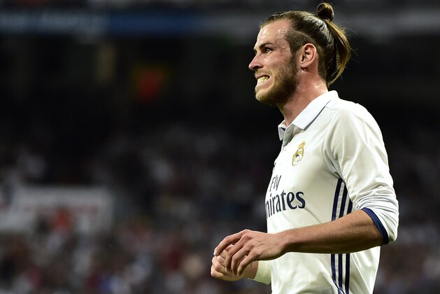 Real Madrid's Welsh forward Gareth Bale grimaces after missing a goal opportunity during the Spanish league Clasico football match Real Madrid CF vs FC Barcelona at the Santiago Bernabeu stadium in Madrid on April 23, 2017.
Barcelona won 3-2. / AFP PHOTO / GERARD JULIEN        (Photo credit should read GERARD JULIEN/AFP/Getty Images)