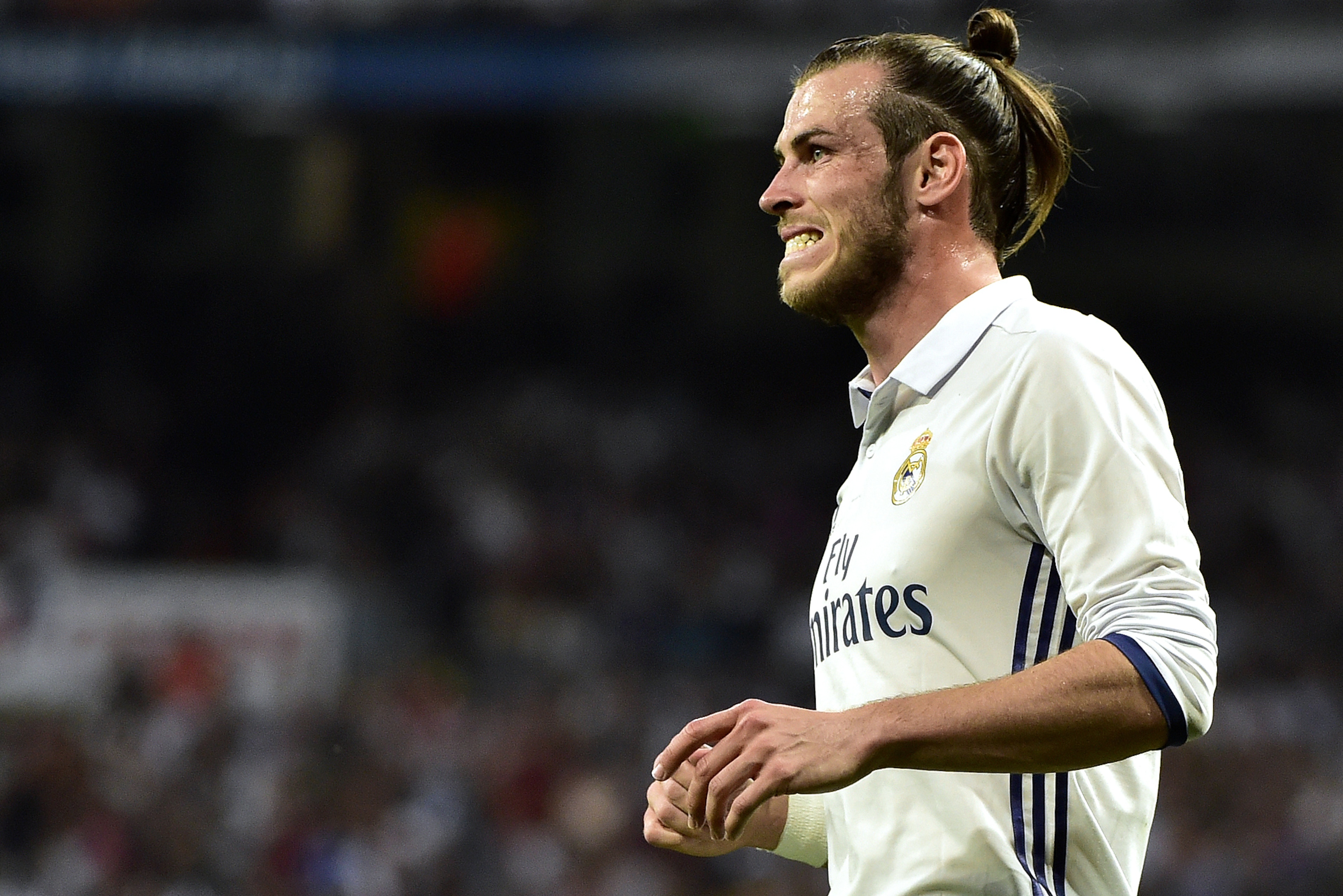 Real Madrid's Welsh forward Gareth Bale grimaces after missing a goal opportunity during the Spanish league Clasico football match Real Madrid CF vs FC Barcelona at the Santiago Bernabeu stadium in Madrid on April 23, 2017.
Barcelona won 3-2. / AFP PHOTO / GERARD JULIEN        (Photo credit should read GERARD JULIEN/AFP/Getty Images)