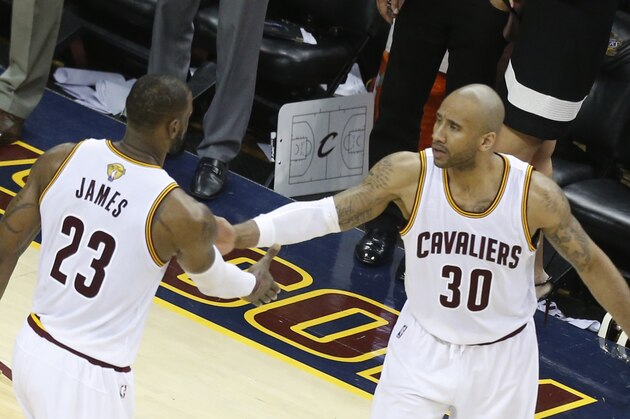 Cleveland Cavaliers forward LeBron James (L) and forward Dahntay Jones celebrate their win over the Golden State Warriors during Game 6 of the NBA Finals in Cleveland, Ohio on June 16, 2016. / AFP / Jay LaPrete        (Photo credit should read JAY LAPRETE/AFP/Getty Images)