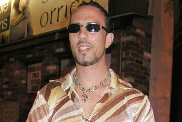 WEST HOLLYWOOD:  Former World Wrestling Federation Champion X-Pac signs autographs poses on September 01, 2003 in West Hollywood, California.  (Photo by Alexander Sibaja/Getty Images)