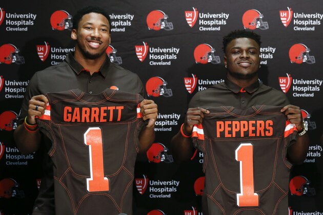 The Cleveland Browns first round draft choices, from left, Myles Garrett, Jabrill Peppers, and David Njoku pose for pictures during an NFL football news conference at the team's training facility, Friday, April 28, 2017, in Berea, Ohio. (AP Photo/Ron Schwane)
