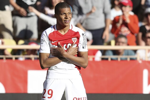 Monaco's French forward Kylian Mbappe Lottin celebrates after scoring a goal during the French L1 football match Monaco (ASM) vs Toulouse (TFC) on April 29, 2017 at the 'Louis II Stadium' in Monaco.   / AFP PHOTO / VALERY HACHE        (Photo credit should read VALERY HACHE/AFP/Getty Images)