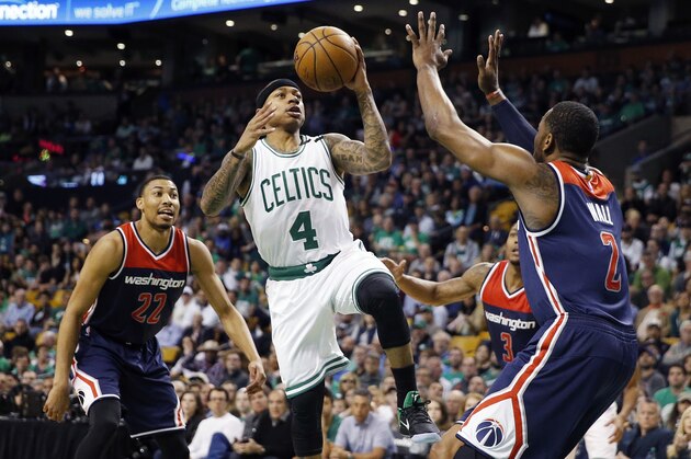 Boston Celtics' Isaiah Thomas (4) goes up to shoot against Washington Wizards' John Wall (2) during the first quarter of a second-round NBA playoff series basketball game, Sunday, April, 30, 2017, in Boston. (AP Photo/Michael Dwyer)