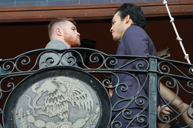 LYNWOOD, CA - FEBRUARY 24:  Canelo Alvarez and Julio Cesar Chavez face off during a press tour at the Plaza Mexico on February 24, 2017 in Lynwood, California.  (Photo by Josh Lefkowitz/Getty Images)
