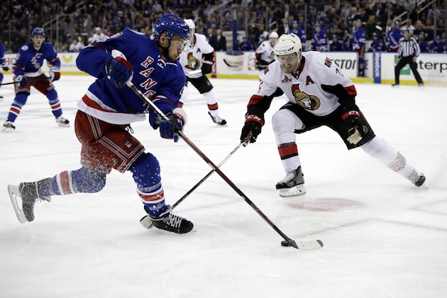 New York Rangers' Michael Grabner (40) looks to control the puck in front of Ottawa Senators' Dion Phaneuf (2) during the second period of Game 3 of an NHL hockey Stanley Cup second-round playoff series Tuesday, May 2, 2017, in New York. The Rangers won 4-1. (AP Photo/Frank Franklin II)