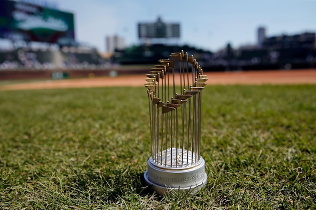 CHICAGO, IL - APRIL 15: A replica World Series Trophy, today's promotional giveaway, on the field before the game between the Chicago Cubs and the Pittsburgh Pirates at Wrigley Field on April 15, 2017 in Chicago, Illinois.  (Photo by Jon Durr/Getty Images)