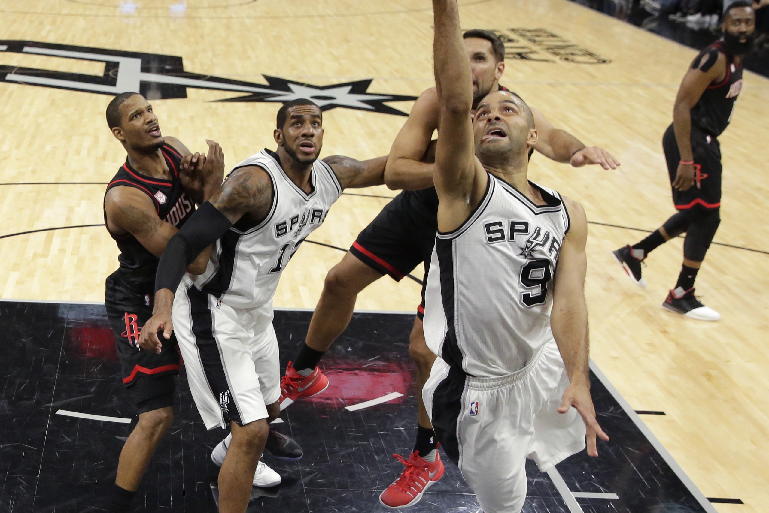San Antonio Spurs guard Tony Parker (9) shoots against the Houston Rockets during the first half in a second-round NBA playoff series basketball game, Monday, May 1, 2017, in San Antonio. (AP Photo/Eric Gay)