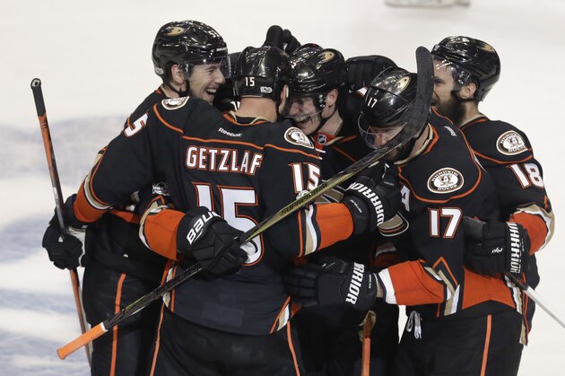 Members of the Anaheim Ducks celebrates after center Ryan Getzlaf's (15) tie-breaking goal against the Calgary Flames during the third period in Game 2 of a first-round NHL hockey Stanley Cup playoff series in Anaheim, Calif., Saturday, April 15, 2017. The Ducks won 3-2. (AP Photo/Chris Carlson)