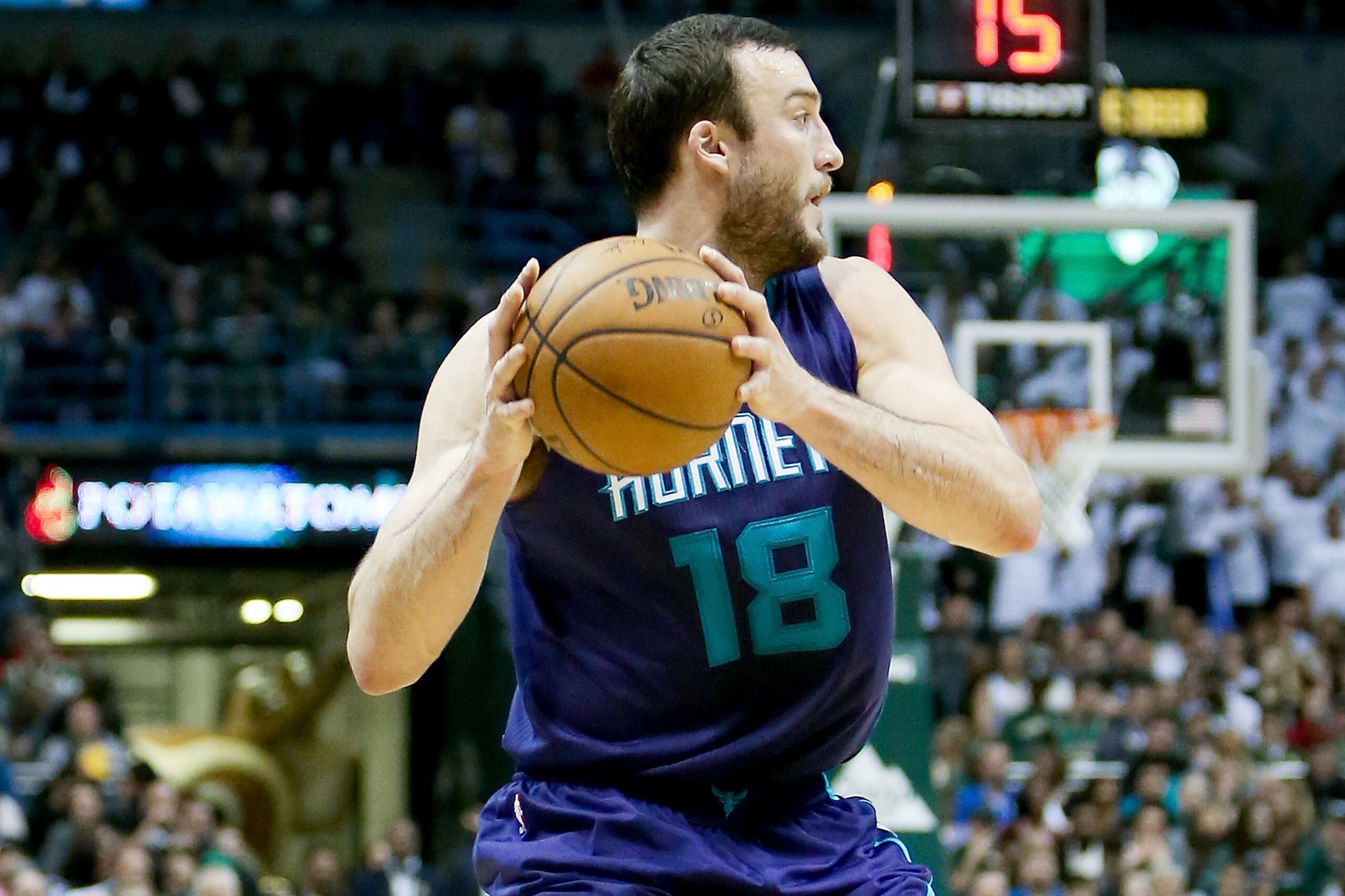 MILWAUKEE, WI - APRIL 10:  Miles Plumlee #18 of the Charlotte Hornets handles the ball in the fourth quarter against the Milwaukee Bucks at BMO Harris Bradley Center on April 10, 2017 in Milwaukee, Wisconsin. NOTE TO USER: User expressly acknowledges and agrees that , by downloading and or using this photograph, User is consenting to the terms and conditions of the Getty Images License Agreement. (Photo by Dylan Buell/Getty Images)