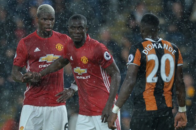 HULL, ENGLAND - AUGUST 27: Paul Pogba (L1), of Manchester United with Eric Bailly of Manchester United (L2), during the Premier League match between Manchester United FC and Hull City FC at KC Stadium on August 27, 2016 in Hull, England. (Photo by Mark Runnacles/Getty Images)