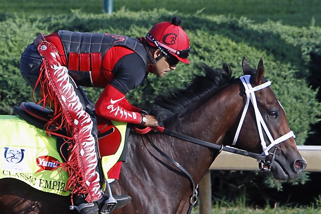 Kentucky Derby hopeful Classic Empire, ridden by exercise rider Martin Rivera, gallops at Churchill Downs in Louisville, Ky., Monday, May 1, 2017. The 143rd running of the Kentucky Derby is Saturday, May 6.(AP Photo/Garry Jones)