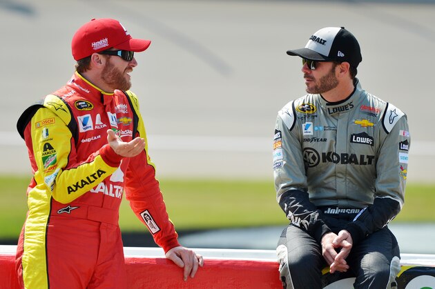 BROOKLYN, MI - JUNE 10:  (L-R) Dale Earnhardt Jr, driver of the #88 Axalta Chevrolet, talks to Jimmie Johnson, driver of the #48 Kobalt Chevrolet, during qualifying for the NASCAR Sprint Cup Series FireKeepers Casino 400 at Michigan International Speedway on June 10, 2016 in Brooklyn, Michigan.  (Photo by Drew Hallowell/Getty Images )
