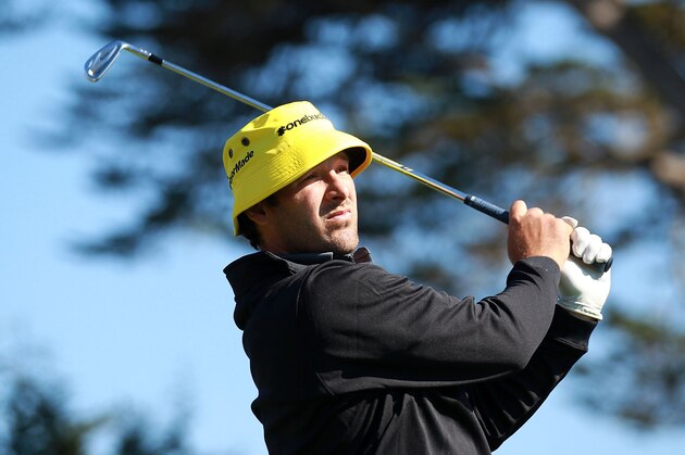 PEBBLE BEACH, CA - FEBRUARY 09:  Tony Romo of the Dallas Cowboys watches his tee shot on the 17th hole during the third round of the AT&T Pebble Beach National Pro-Am at Pebble Beach Golf Links on February 9, 2013 in Pebble Beach, California.  (Photo by Jed Jacobsohn/Getty Images)