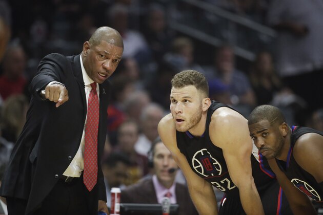 Los Angeles Clippers' Doc Rivers, left, talks to Blake Griffin, center, and Chris Paul during the first half of an NBA basketball game against the Cleveland Cavaliers Saturday, March 18, 2017, in Los Angeles. (AP Photo/Jae C. Hong)