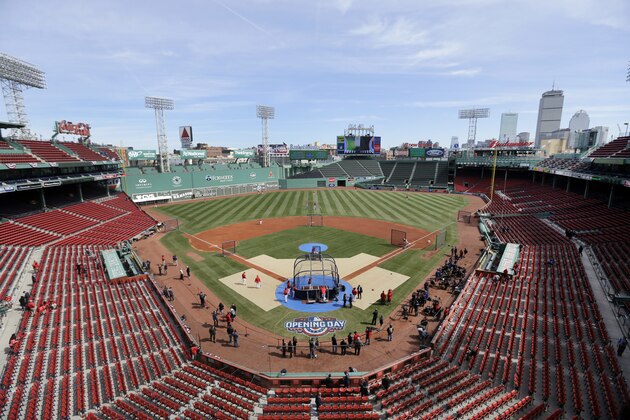 Boston Red Sox players surround the batting cage during pre-game warm-ups before the Red Sox baseball Home Opener against the Pittsburgh Pirates at Fenway Park, Monday, April 3, 2017, in Boston. (AP Photo/Elise Amendola)