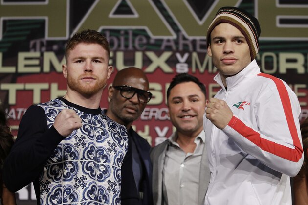 Canelo Alvarez, left, and Julio Cesar Chavez Jr. pose for photographers during a news conference Wednesday, May 3, 2017, in Las Vegas. The two are scheduled to fight in a 164.5 pound catch weight boxing match Saturday in Las Vegas. (AP Photo/John Locher)