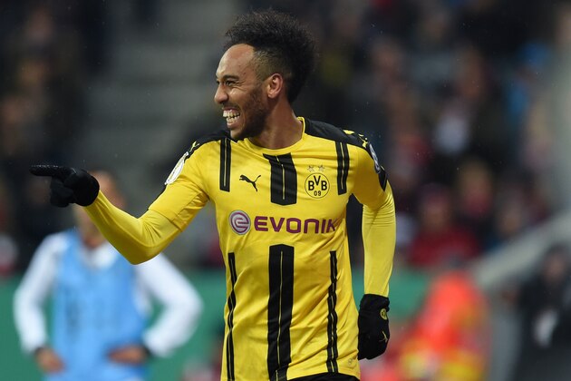 Dortmund's Gabonese striker Pierre-Emerick Aubameyang celebrates after the second goal for Dortmund during the German Cup DFB Pokal semifinal football match between FC Bayern Munich and BVB Borussia Dortmund in Munich, on April 26, 2017. / AFP PHOTO / Christof STACHE / RESTRICTIONS: ACCORDING TO DFB RULES IMAGE SEQUENCES TO SIMULATE VIDEO IS NOT ALLOWED DURING MATCH TIME. MOBILE (MMS) USE IS NOT ALLOWED DURING AND FOR FURTHER TWO HOURS AFTER THE MATCH. == RESTRICTED TO EDITORIAL USE == FOR MORE INFORMATION CONTACT DFB DIRECTLY AT +49 69 67880

 /         (Photo credit should read CHRISTOF STACHE/AFP/Getty Images)