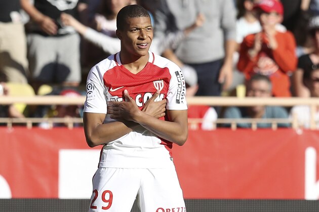 Monaco's French forward Kylian Mbappe Lottin celebrates after scoring a goal during the French L1 football match Monaco (ASM) vs Toulouse (TFC) on April 29, 2017 at the 'Louis II Stadium' in Monaco.   / AFP PHOTO / VALERY HACHE        (Photo credit should read VALERY HACHE/AFP/Getty Images)