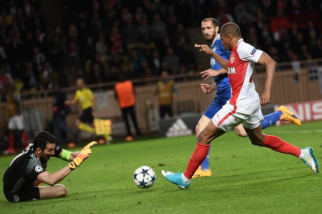 Juventus' goalkeeper from Italy Gianluigi Buffon (L) prepares to block a shot on goal by Monaco's French forward Kylian Mbappe during the UEFA Champions League semi-final first leg football match Monaco vs Juventus at the Stade Louis II stadium in Monaco on May 3, 2017.  / AFP PHOTO / Anne-Christine POUJOULAT        (Photo credit should read ANNE-CHRISTINE POUJOULAT/AFP/Getty Images)