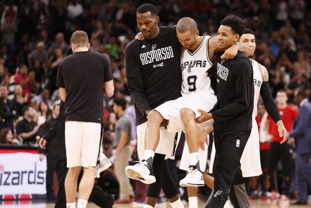 May 3, 2017; San Antonio, TX, USA; San Antonio Spurs point guard Tony Parker (9) is helped off the court after being injured against the Houston Rockets during the second half in game two of the second round of the 2017 NBA Playoffs at AT&T Center. Mandatory Credit: Soobum Im-USA TODAY Sports