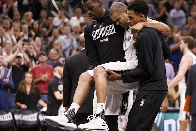 May 3, 2017; San Antonio, TX, USA; San Antonio Spurs point guard Tony Parker (9) is helped off the court after being injured against the Houston Rockets during the second half in game two of the second round of the 2017 NBA Playoffs at AT&T Center. Mandatory Credit: Soobum Im-USA TODAY Sports